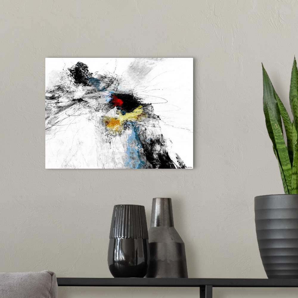 A modern room featuring Black and white abstract painting with pops of red, yellow, and blue in the middle.