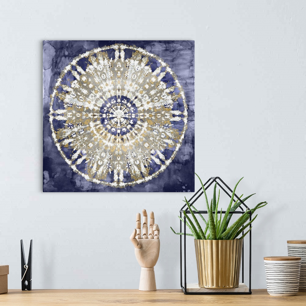A bohemian room featuring Square abstract decor with a white, gold, and silver mandala on an indigo background.