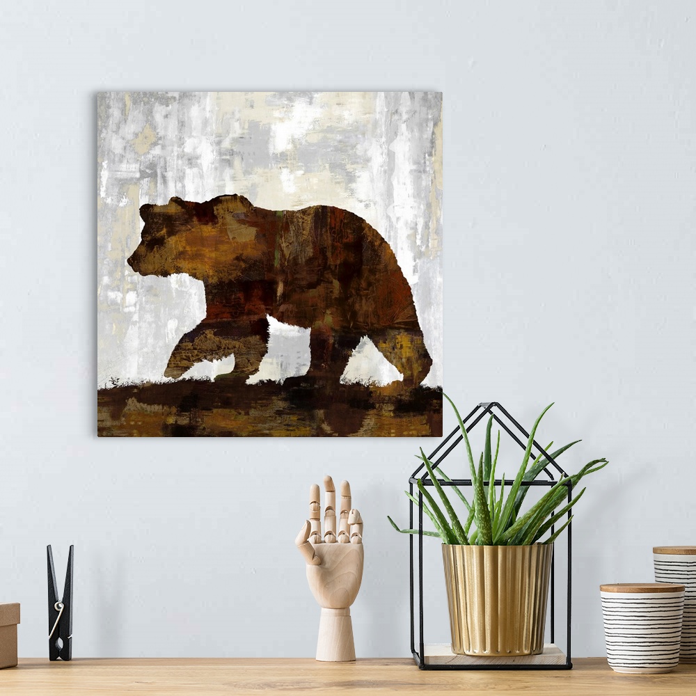 A bohemian room featuring Square decor with a silhouette of a brown bear on a gray, tan, and white background.