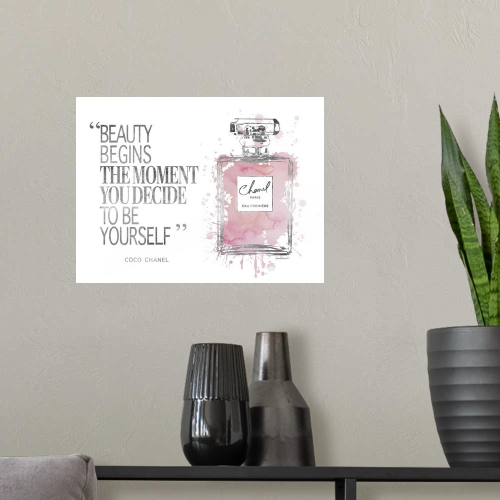 A modern room featuring Decorative artwork with the words: Beauty begins the moment you decide to be yourself.