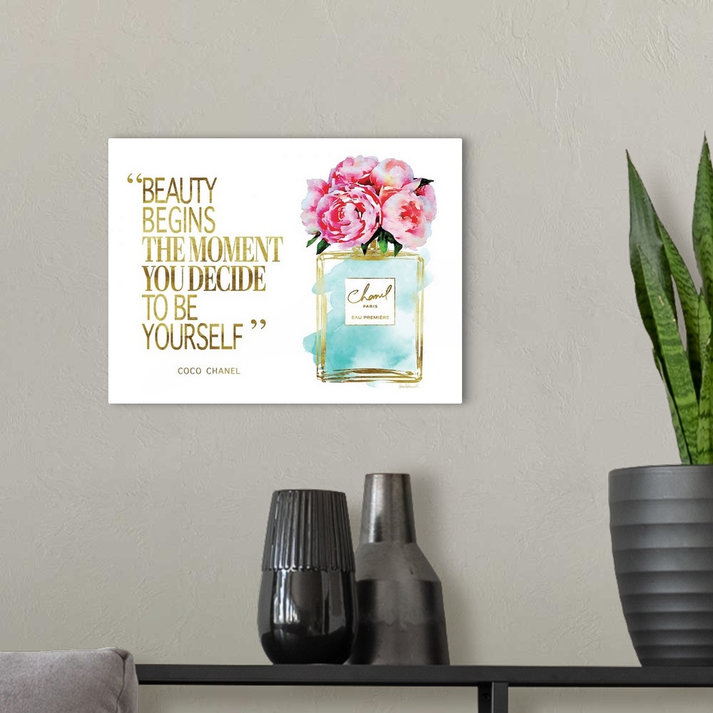 A modern room featuring Decorative artwork with the words: Beauty begins the moment you decide to be yourself.