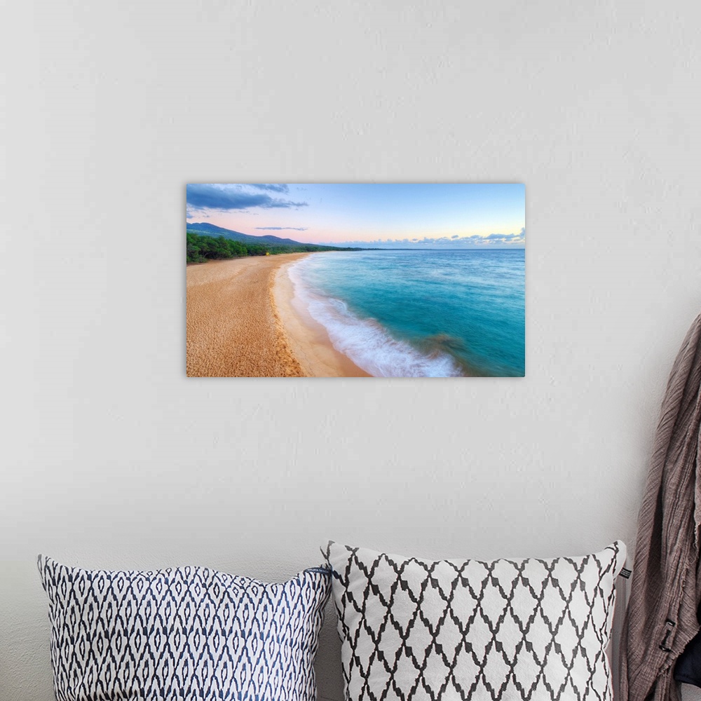 A bohemian room featuring Landscape photograph of an empty beach scene with crystal blue water in Maui.
