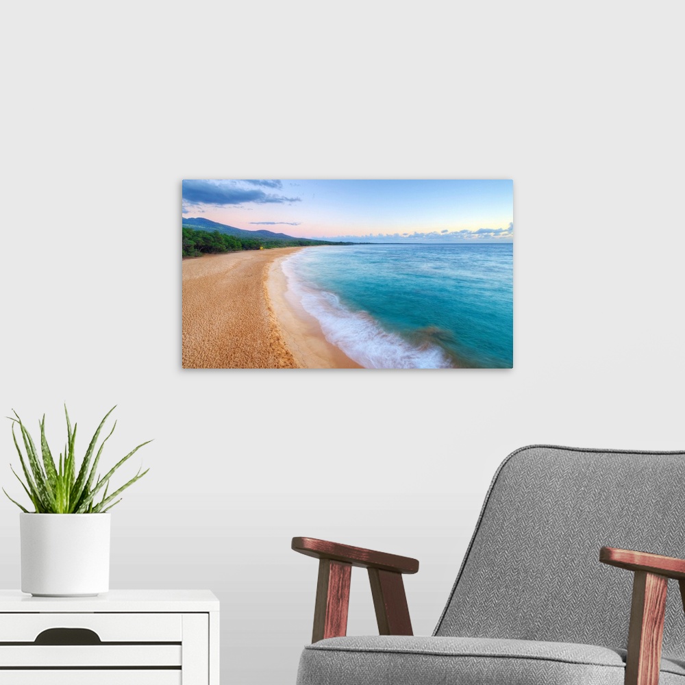 A modern room featuring Landscape photograph of an empty beach scene with crystal blue water in Maui.