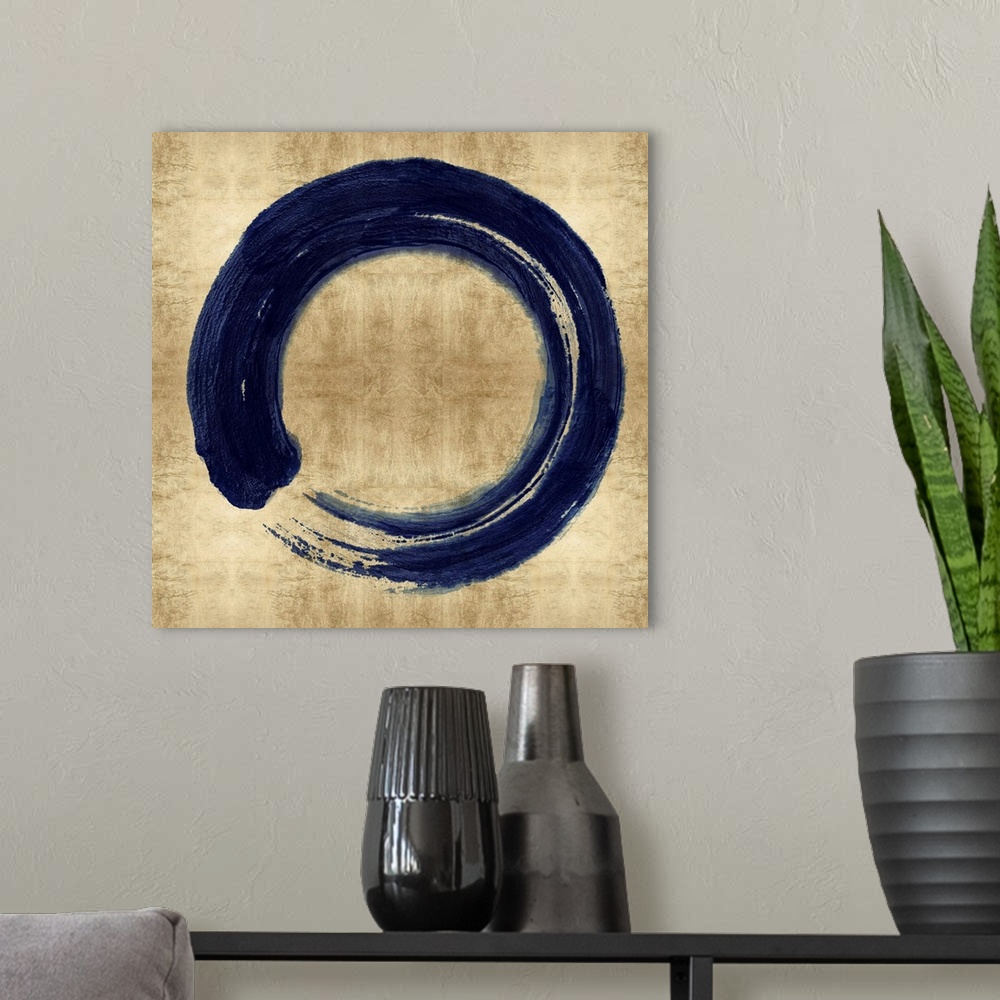 A modern room featuring This Zen artwork features a sweeping circular brush stroke in blue over a mottled gold color back...