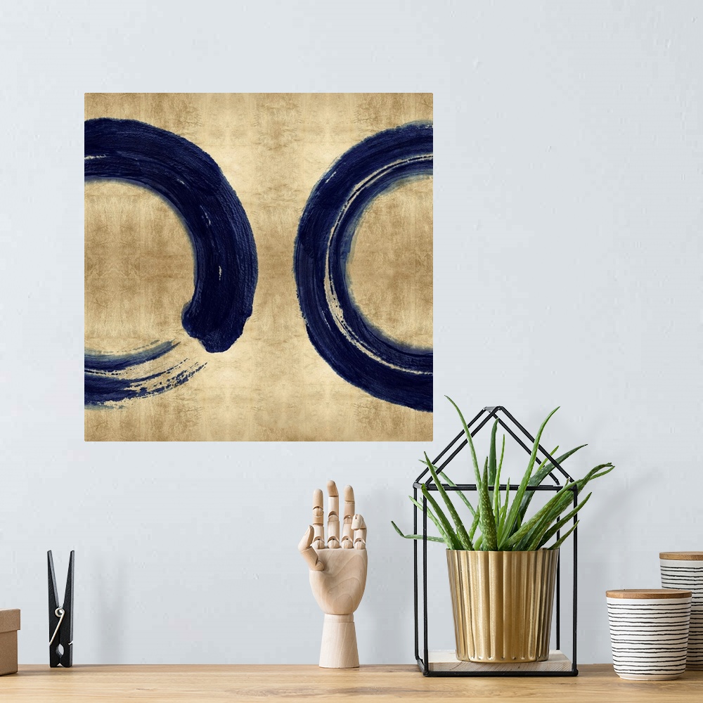 A bohemian room featuring This Zen artwork features two sweeping circular brush strokes in blue over a mottled gold color b...