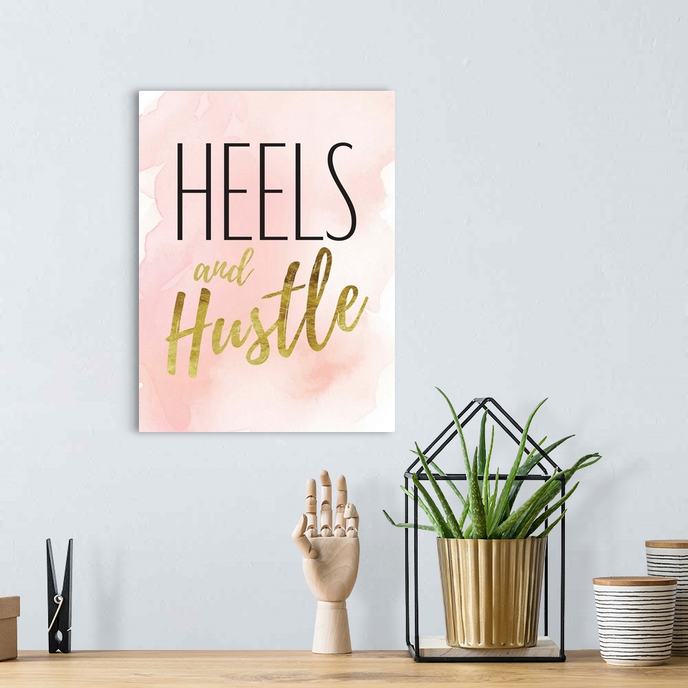 A bohemian room featuring Decorative artwork with the words: Heels and Hustle.