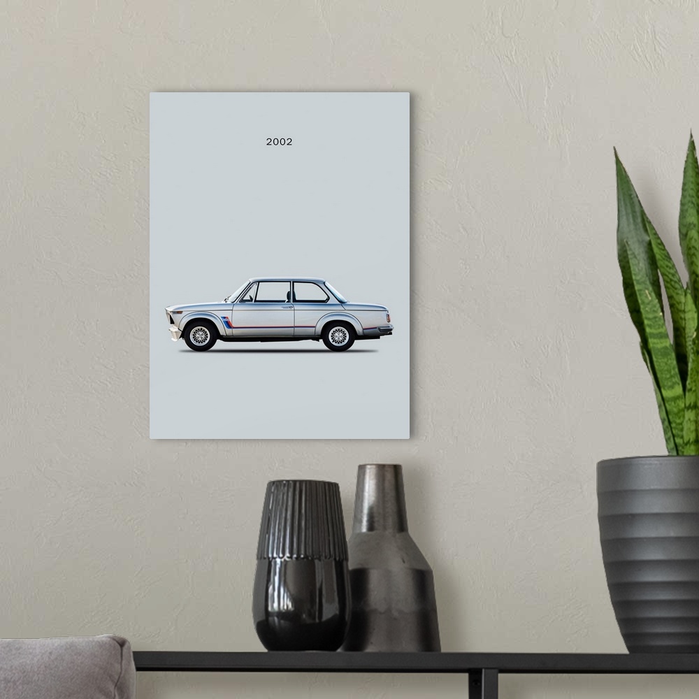 A modern room featuring Photograph of a silver BMW 2002 Turbo printed on a gray background