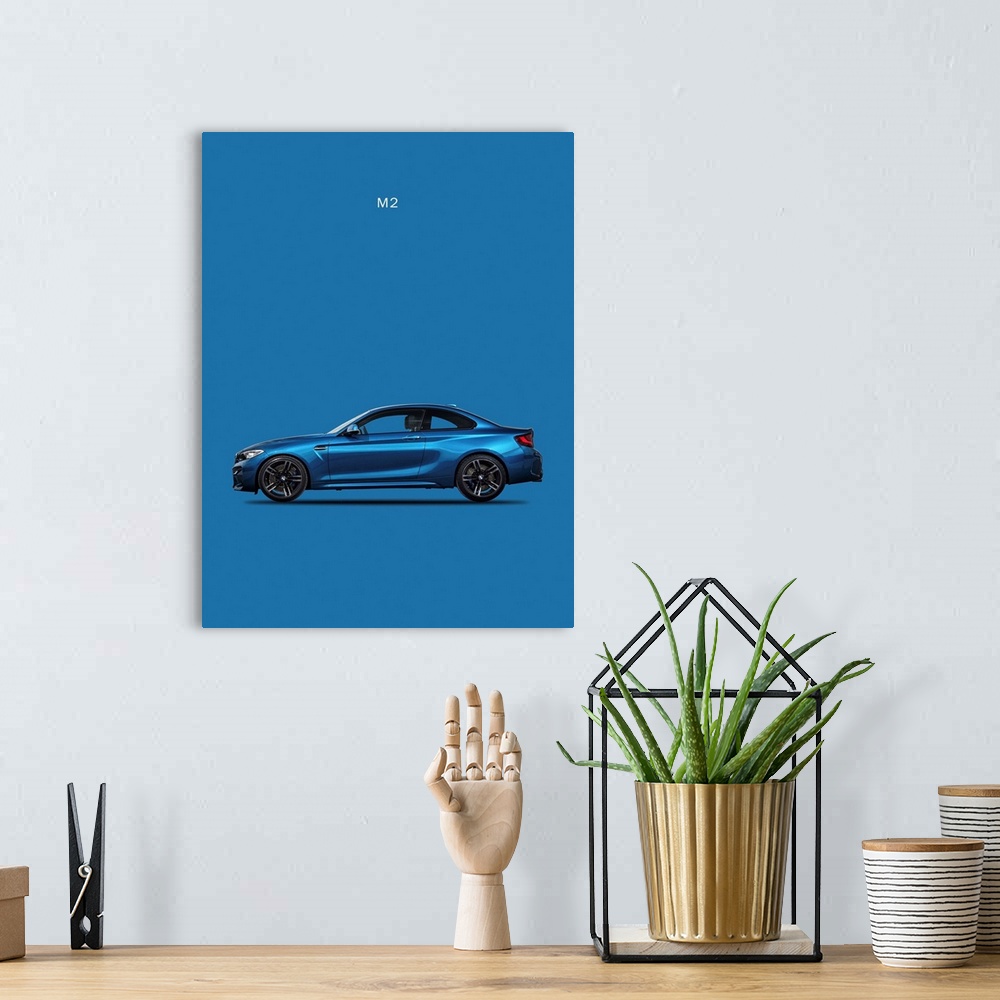 A bohemian room featuring Photograph of a blue BMW M2 printed on a blue background