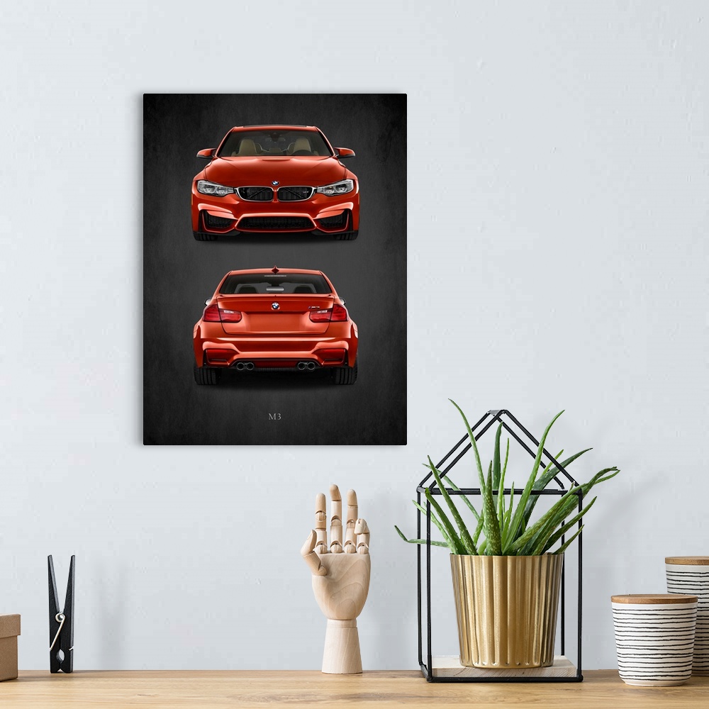 A bohemian room featuring Photograph of the front and back of an orange-red BMW M3 printed on a black background with a dar...