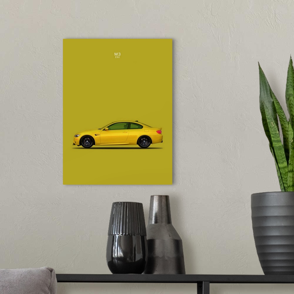 A modern room featuring Photograph of a yellow BMW M3 E92 printed on a yellow-green background