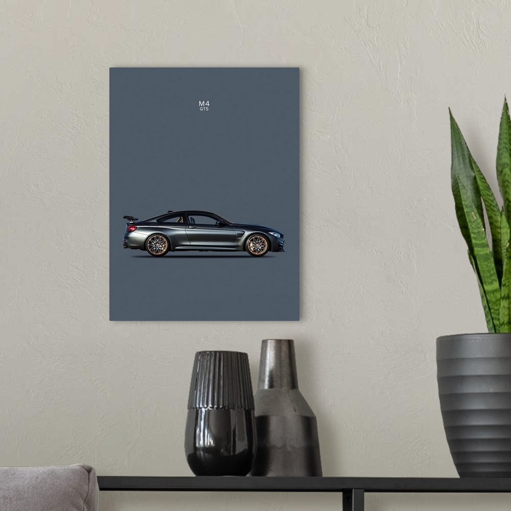 A modern room featuring Photograph of a dark gray BMW M4 GTS printed on a dark gray background