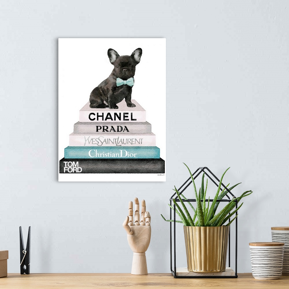 A bohemian room featuring A french bulldog sits atop a stack of designer books.