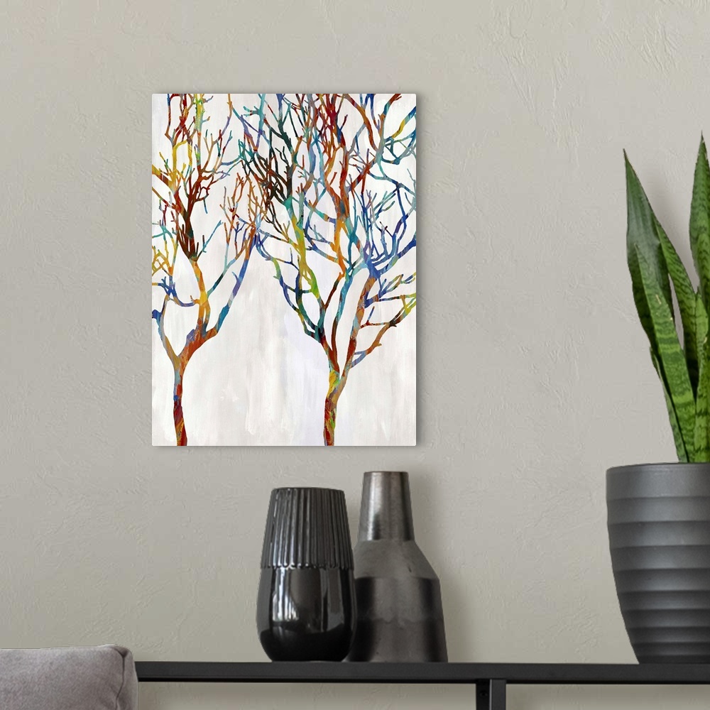 A modern room featuring Colorful silhouettes of two leafless trees on a white and gray background.