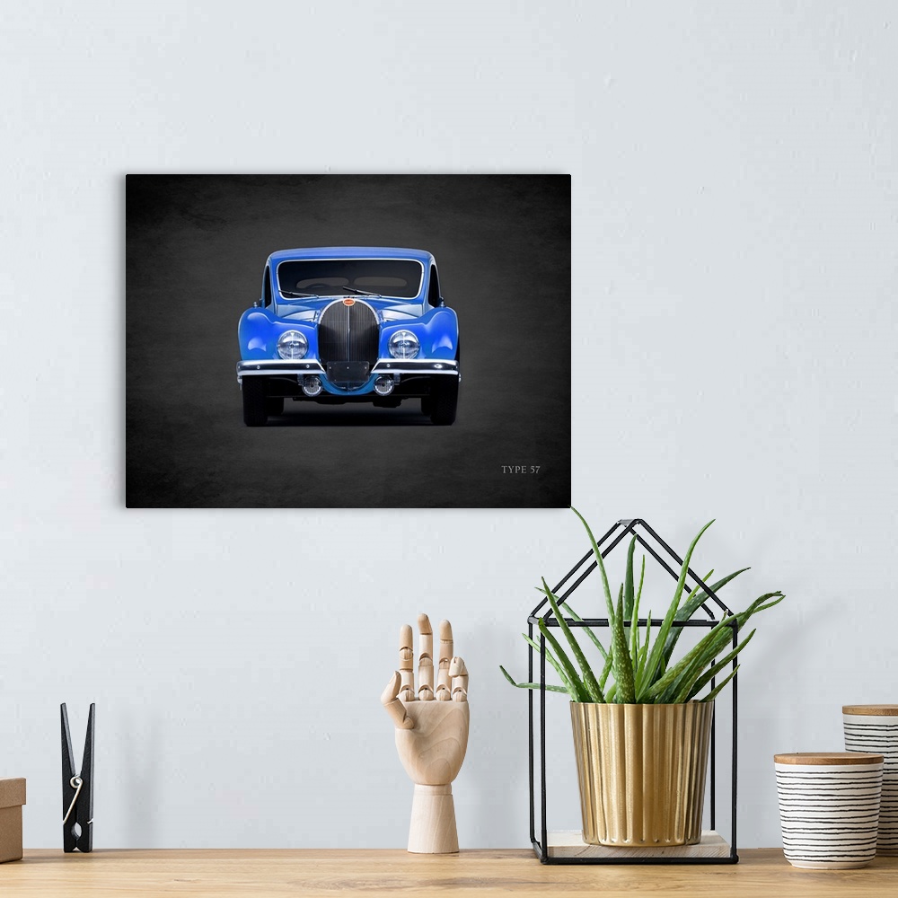 A bohemian room featuring Photograph of a blue 1936 Bugatti Type-57 printed on a black background with a dark vignette.