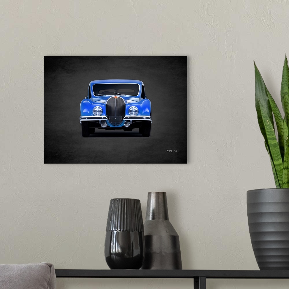 A modern room featuring Photograph of a blue 1936 Bugatti Type-57 printed on a black background with a dark vignette.