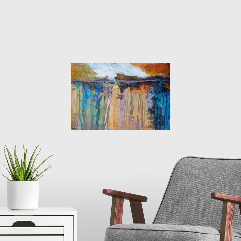 A modern room featuring Abstract landscape painting with vibrant dripping hues forming a lake surrounded by trees.