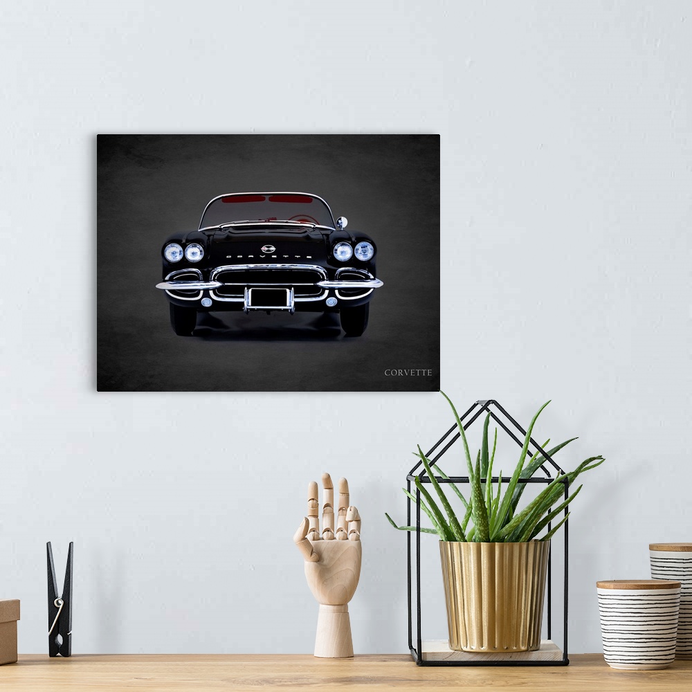 A bohemian room featuring Photograph of a black 1962 Chevrolet Corvette printed on a black background with a dark vignette.