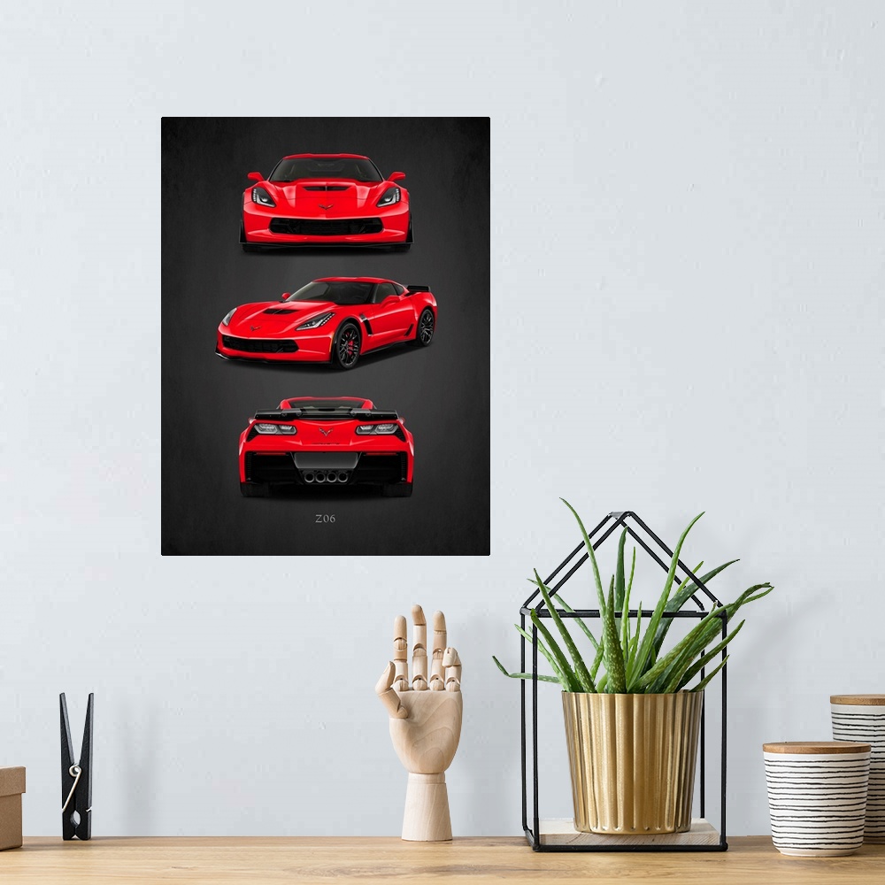 A bohemian room featuring Photograph of the front, back, and side view of a red Chevrolet-Corvette-Z06 printed on a black b...