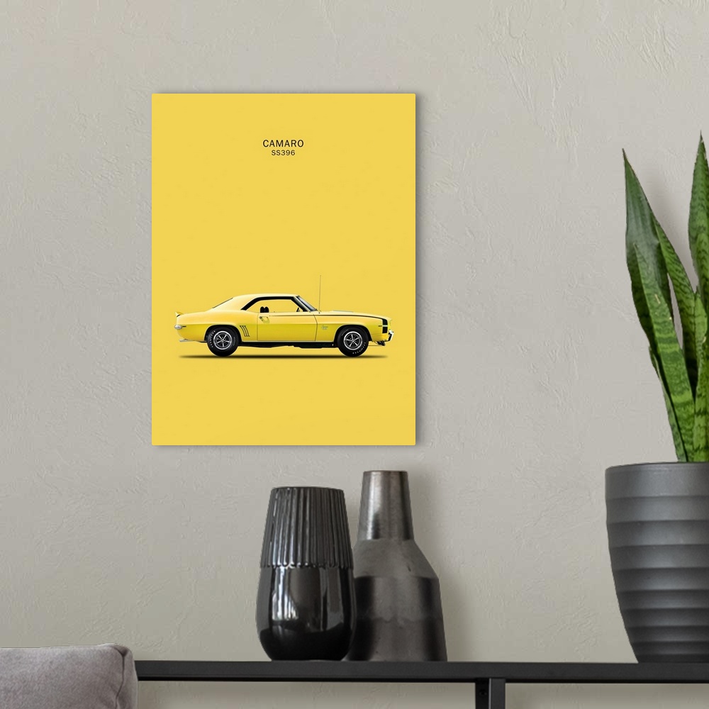 A modern room featuring Photograph of a yellow Chevy Camaro SS396 1969 printed on a yellow background