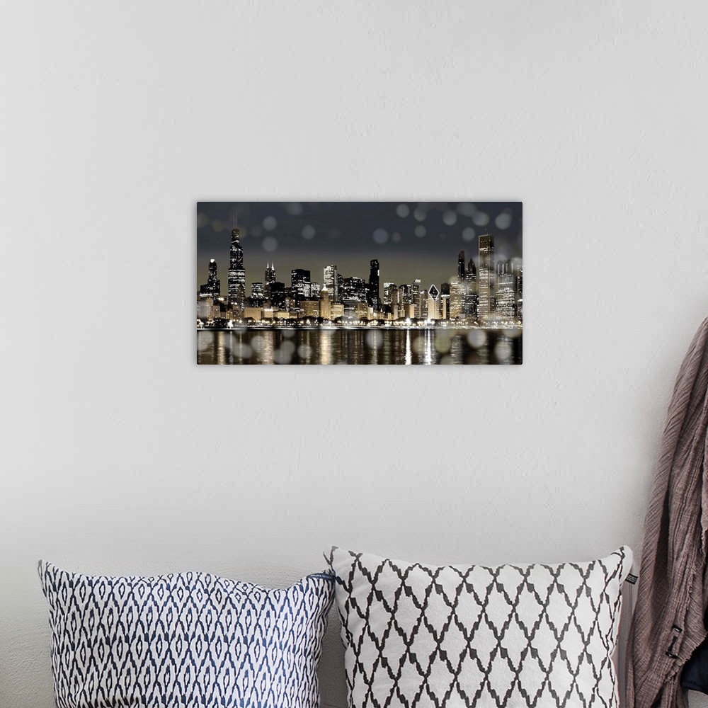 A bohemian room featuring The Chicago skyline lit up at night with from across the water with bokeh lights in the foreground.