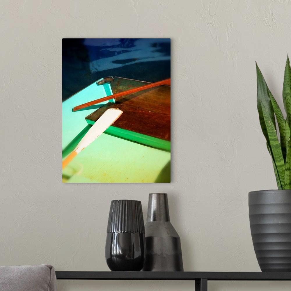 A modern room featuring Photograph of a colorful boat and an oar with an interesting composition.