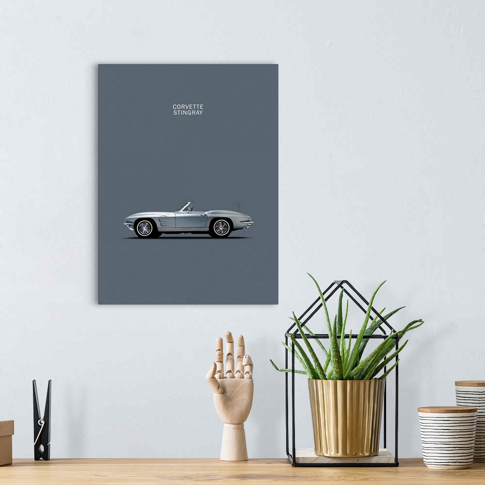 A bohemian room featuring Photograph of a grey Corvette 1965 printed on a grey background