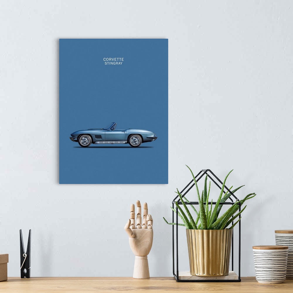 A bohemian room featuring Photograph of a blue Corvette Stingray 1967 printed on a blue background