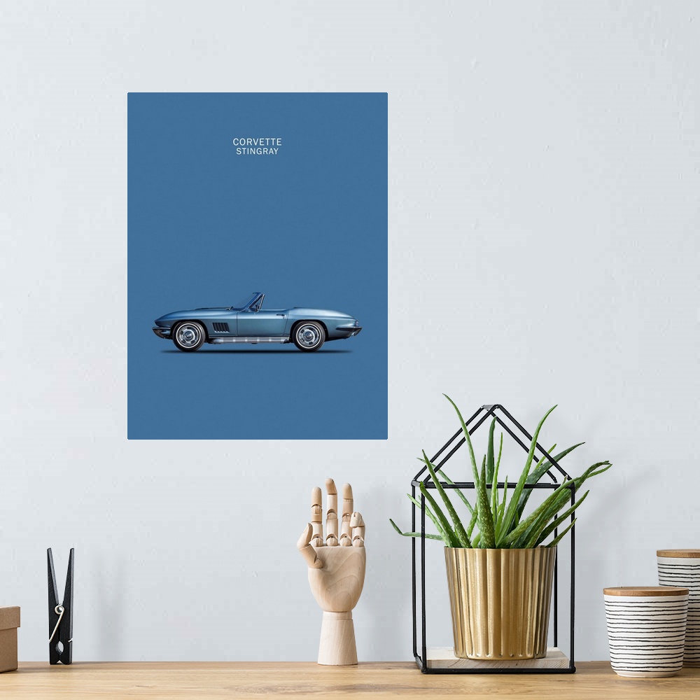 A bohemian room featuring Photograph of a blue Corvette Stingray 1967 printed on a blue background
