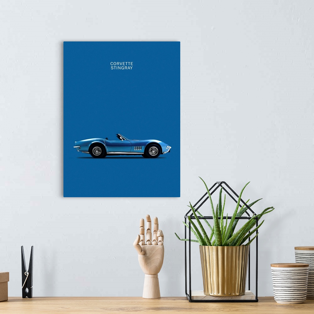 A bohemian room featuring Photograph of a blue Corvette Stingray printed on a blue background