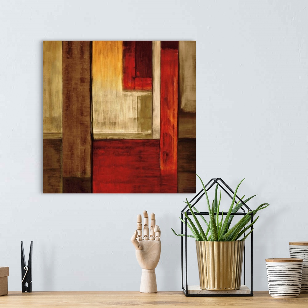 A bohemian room featuring Square abstract art created with rectangular shapes puzzled together in shades of red, orange, wh...