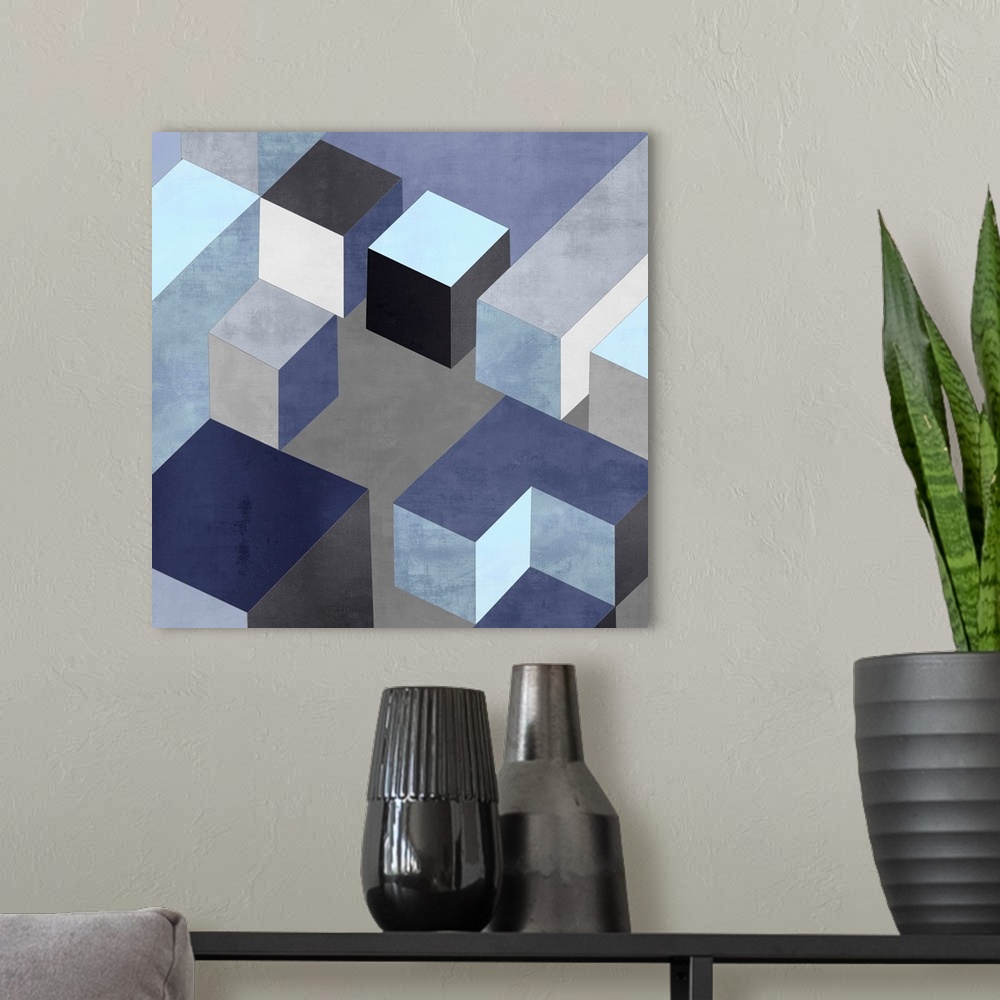 A modern room featuring Abstract square art created with black, white, silver, and blue squares creating 3D looking cubes...