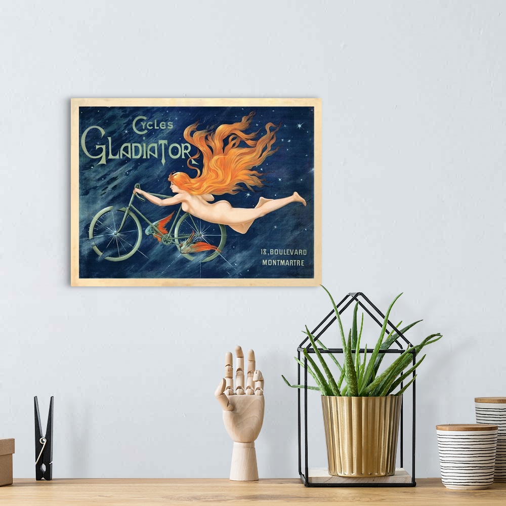 A bohemian room featuring Vintage wall art advertisement for Cycles Gladiator of a nude woman with long flowing hair, holdi...