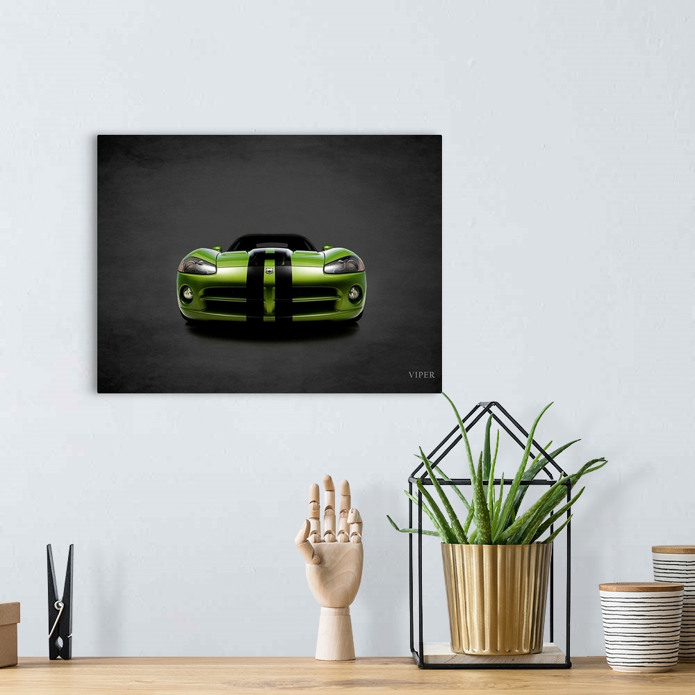 A bohemian room featuring Photograph of a green Dodge Viper with black stripes printed on a black background with a dark vi...