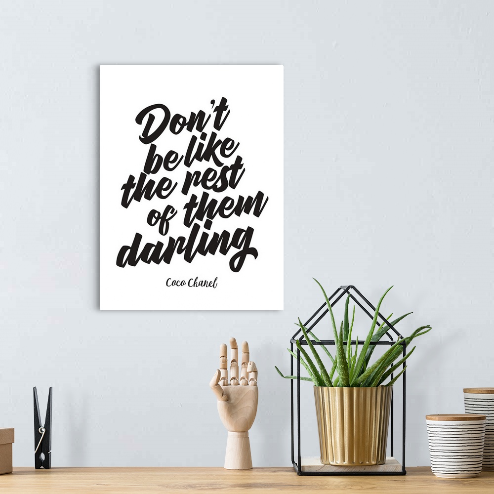 A bohemian room featuring Decorative artwork with the words: Don't be like the rest of them darling.