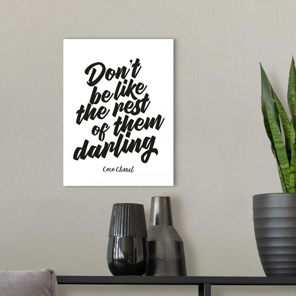 A modern room featuring Decorative artwork with the words: Don't be like the rest of them darling.