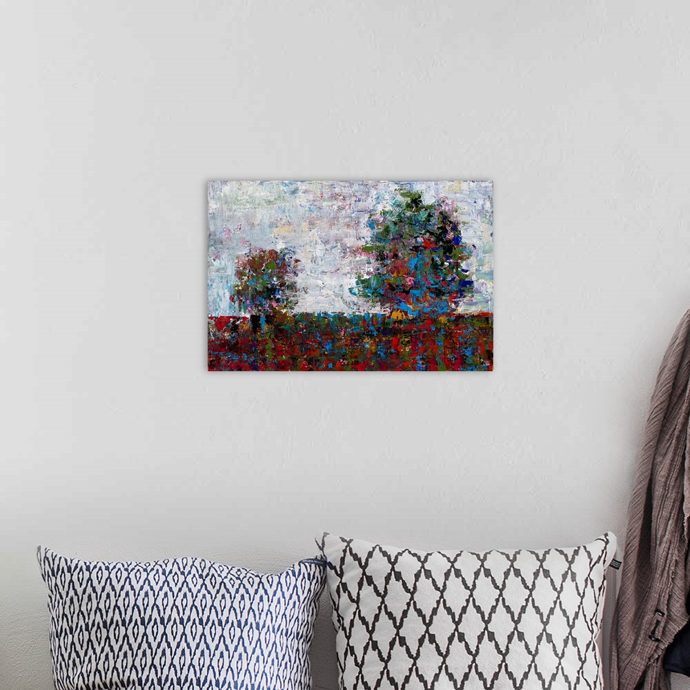 A bohemian room featuring Abstract landscape with two trees created with many colors and small, layered brushstrokes.