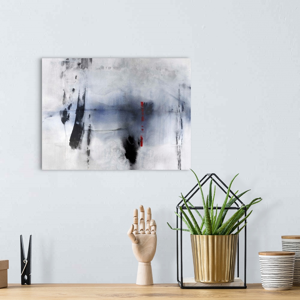 A bohemian room featuring Large abstract painting with a faded background, indigo center, bold black brushstrokes on top, a...