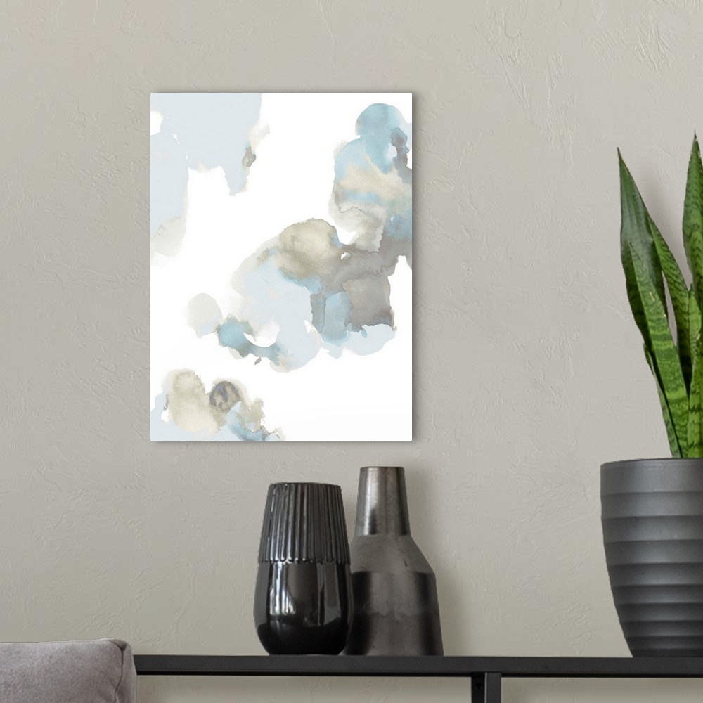 A modern room featuring Abstract painting with light blue and gray hues splattered together on a white background.