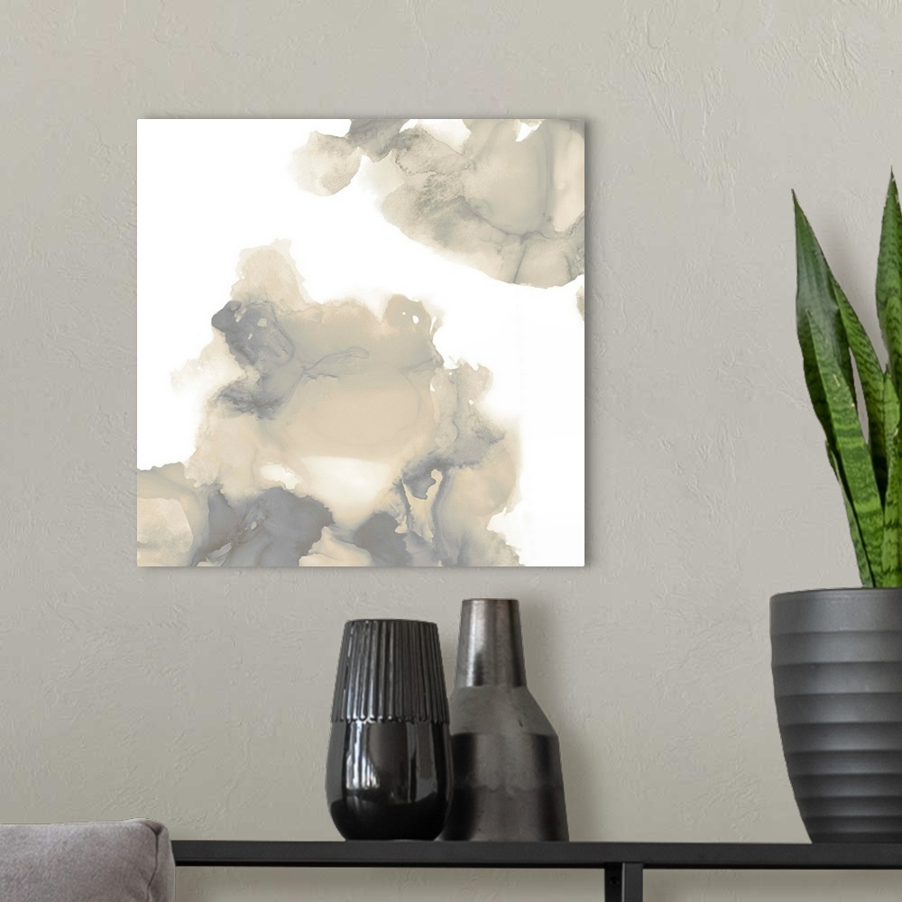 A modern room featuring Abstract painting with tan and gray hues splattered together on a white background.