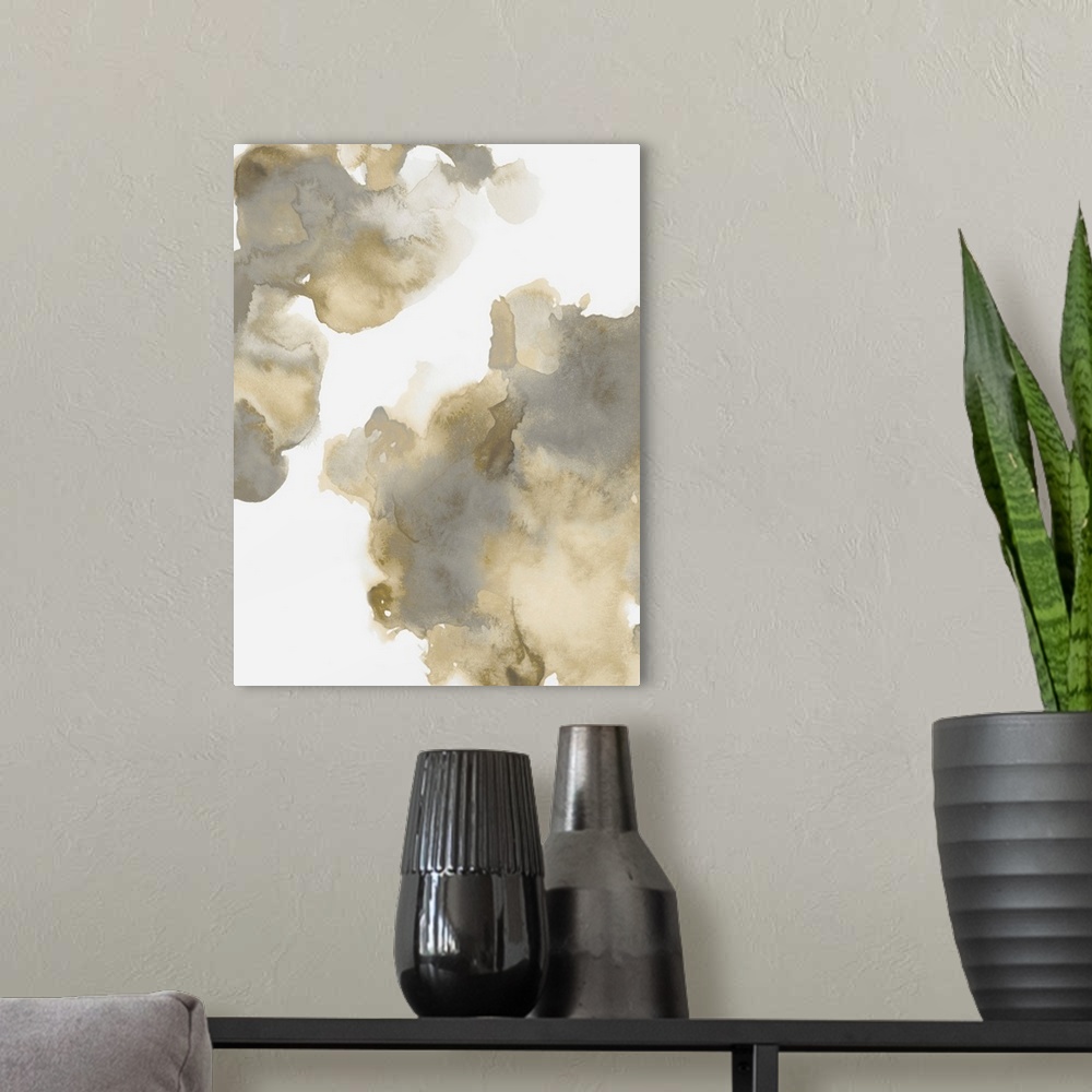 A modern room featuring Abstract painting with gold and gray hues splattered together on a white background.
