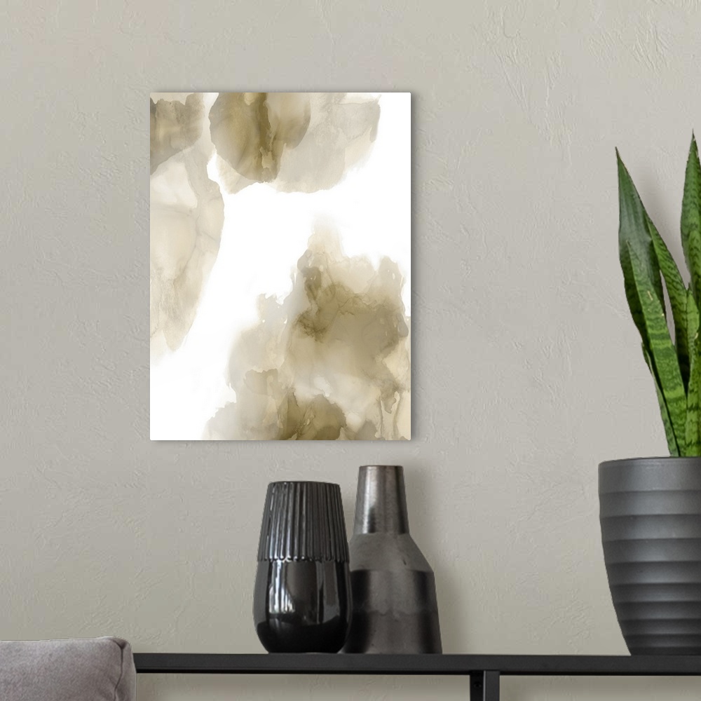 A modern room featuring Abstract painting with gold and gray hues splattered together on a white background.