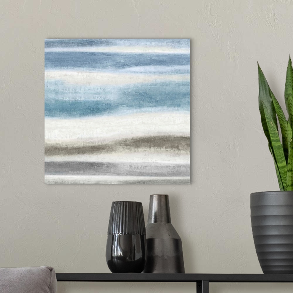 A modern room featuring Square abstract painting created with blue and gray wavy brushstrokes running horizontally across...
