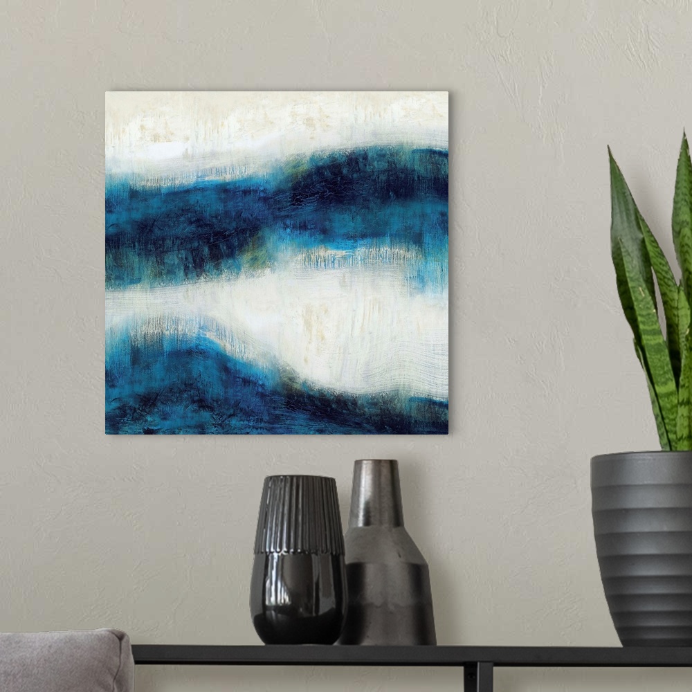 A modern room featuring Square abstract art made with shades of blue and neutral hues.