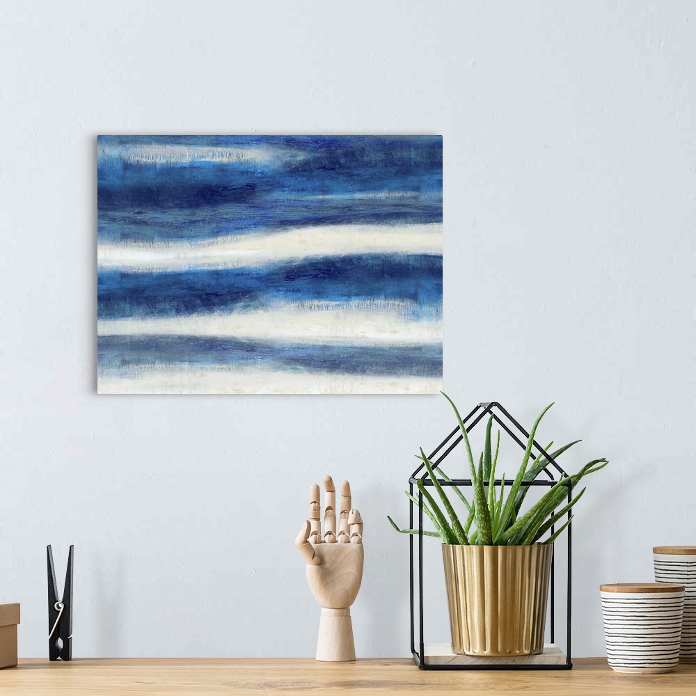 A bohemian room featuring Large abstract painting created with wavy indigo lines running horizontally across the canvas.