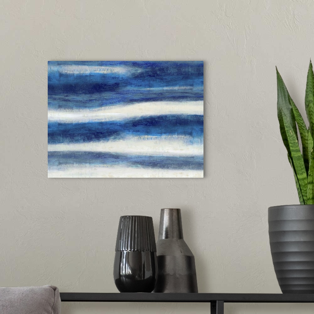 A modern room featuring Large abstract painting created with wavy indigo lines running horizontally across the canvas.