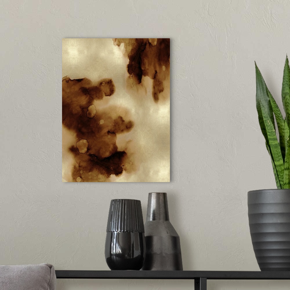 A modern room featuring Abstract painting with bronze hues splattered together on a gold background.