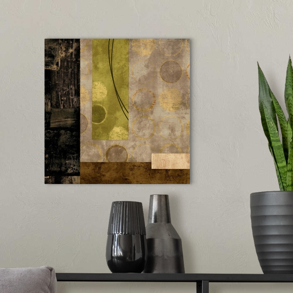 A modern room featuring Square abstract with black, gold, cream, and olive green rectangles and metallic gold circles,