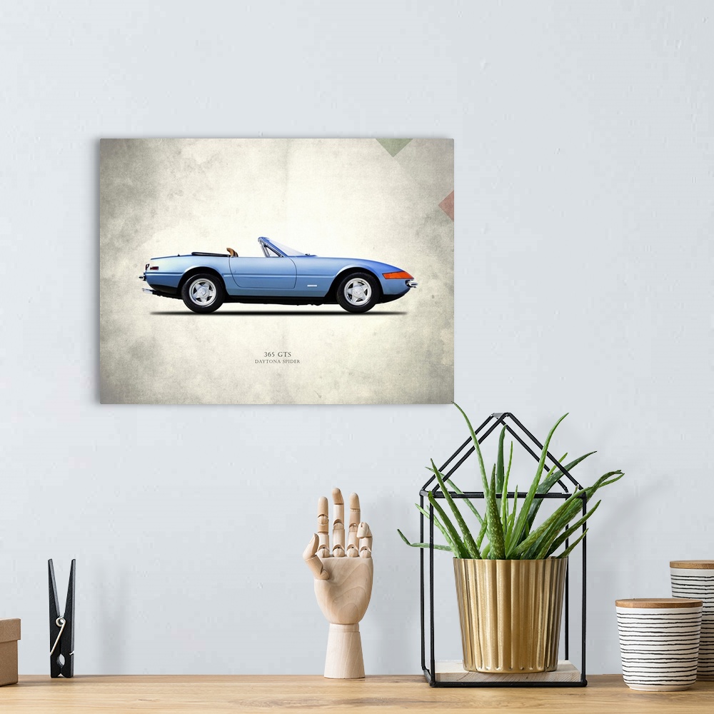 A bohemian room featuring Photograph of a blue Ferrari 365GTS Daytona Spider printed on a distressed white and gray backgro...