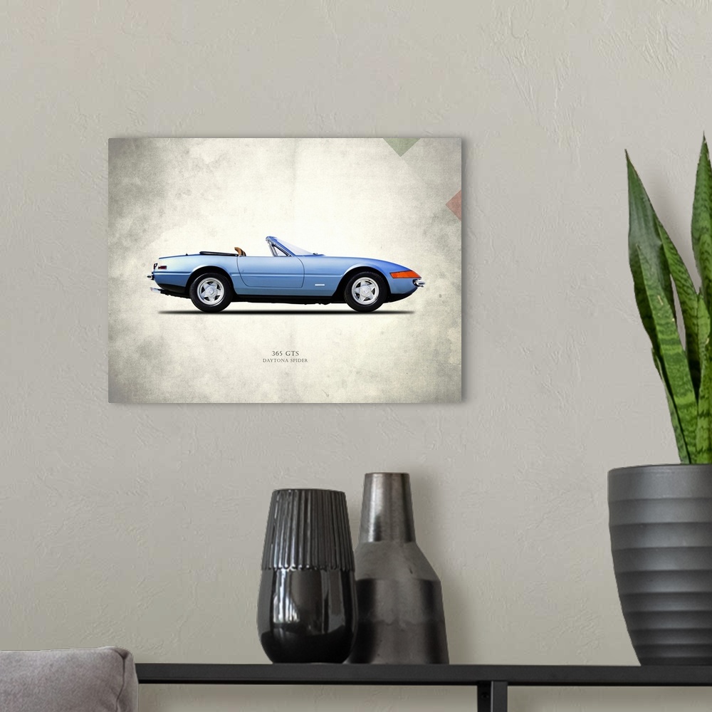 A modern room featuring Photograph of a blue Ferrari 365GTS Daytona Spider printed on a distressed white and gray backgro...