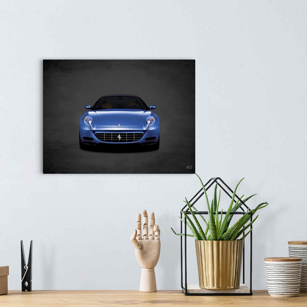 A bohemian room featuring Photograph of a blue Ferrari 612 printed on a black background with a dark vignette.